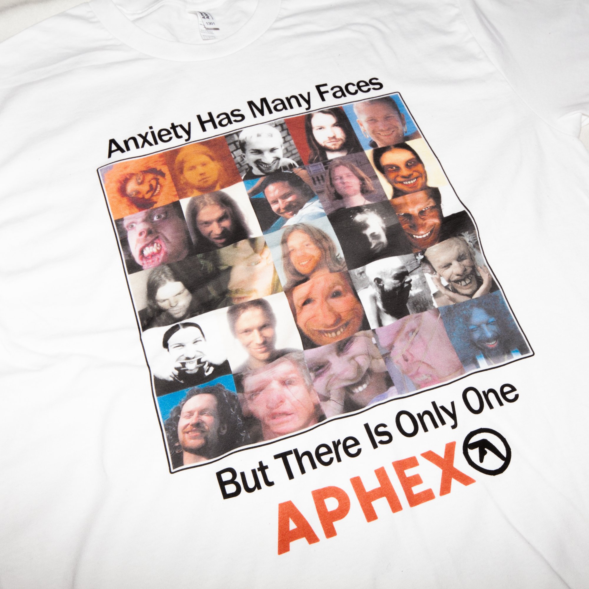Crisis Hotline merch: white t-shirt reading "Anxiety has many faces but there is only one Aphex" with a grid of faces