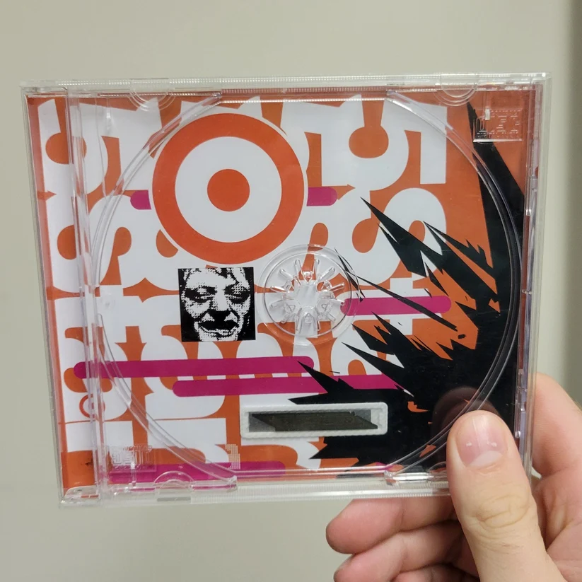 Inside of the Five Star Lucky Winner CD jewel case by Crisis Hotline with orange pattern artwork