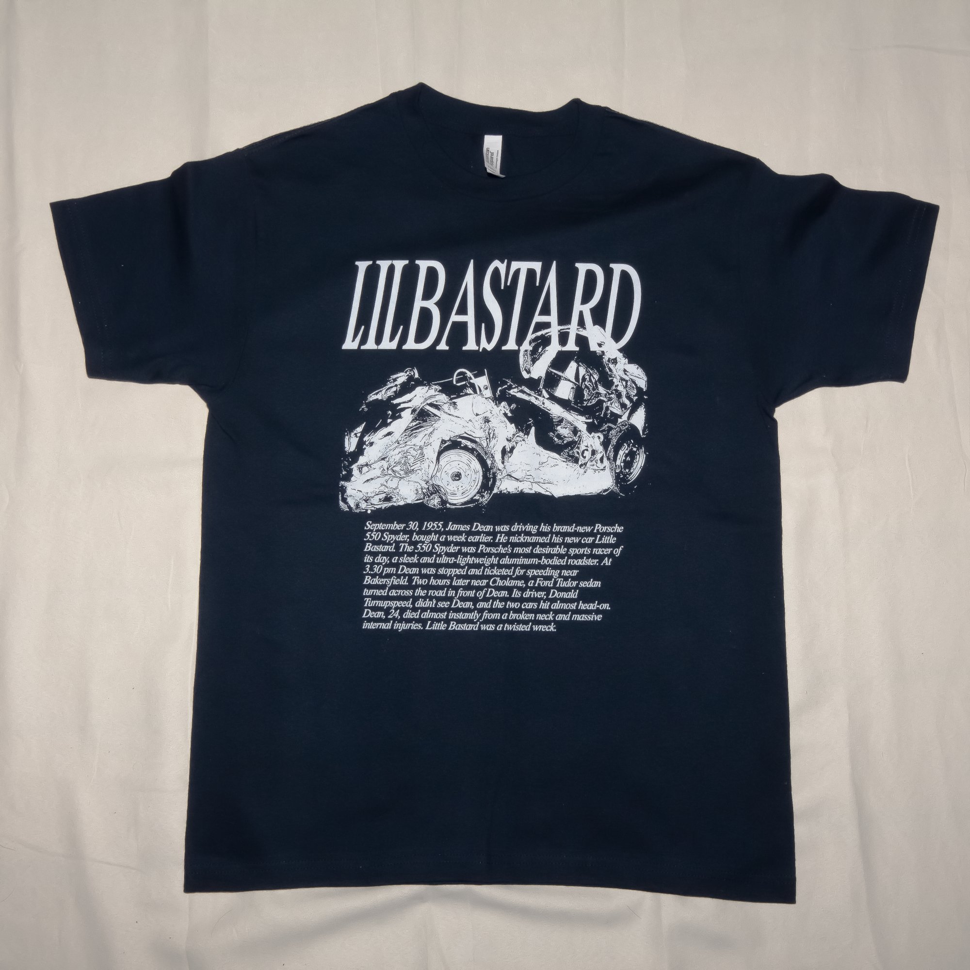 Crisis Hotline merch: navy LILBASTARD t-shirt with a car crash graphic